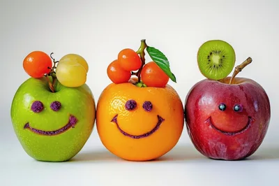 Three Smiling Fruit Characters With Decorative Faces