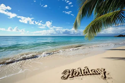 Holiday Written In The Sand On A Tropical Beach