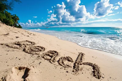 Word Beach Written In Sand On Tropical Shoreline