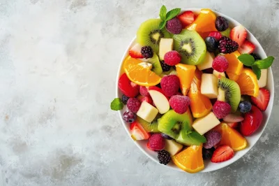 Fresh Fruit Salad Bowl on Textured Surface