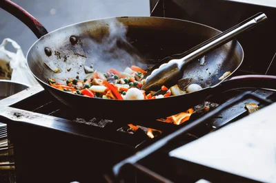 Stir Frying Vegetables In A Hot Wok