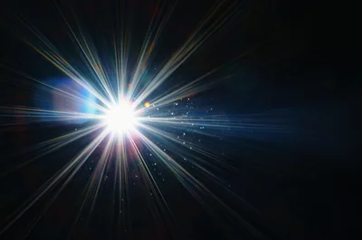 Bright Starburst Light Flare With Dust Particles