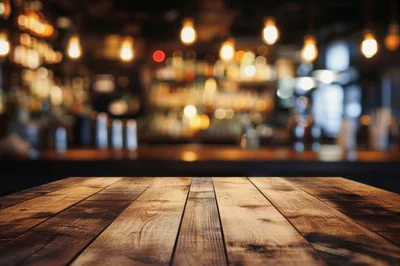 Empty Wooden Table In A Dimly Lit Bar