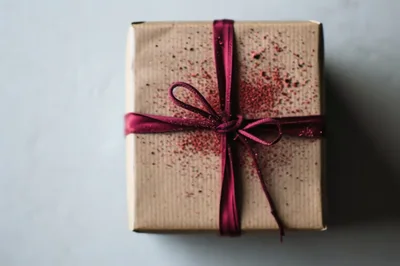 Gift Box Wrapped in Brown Paper with Burgundy Ribbon