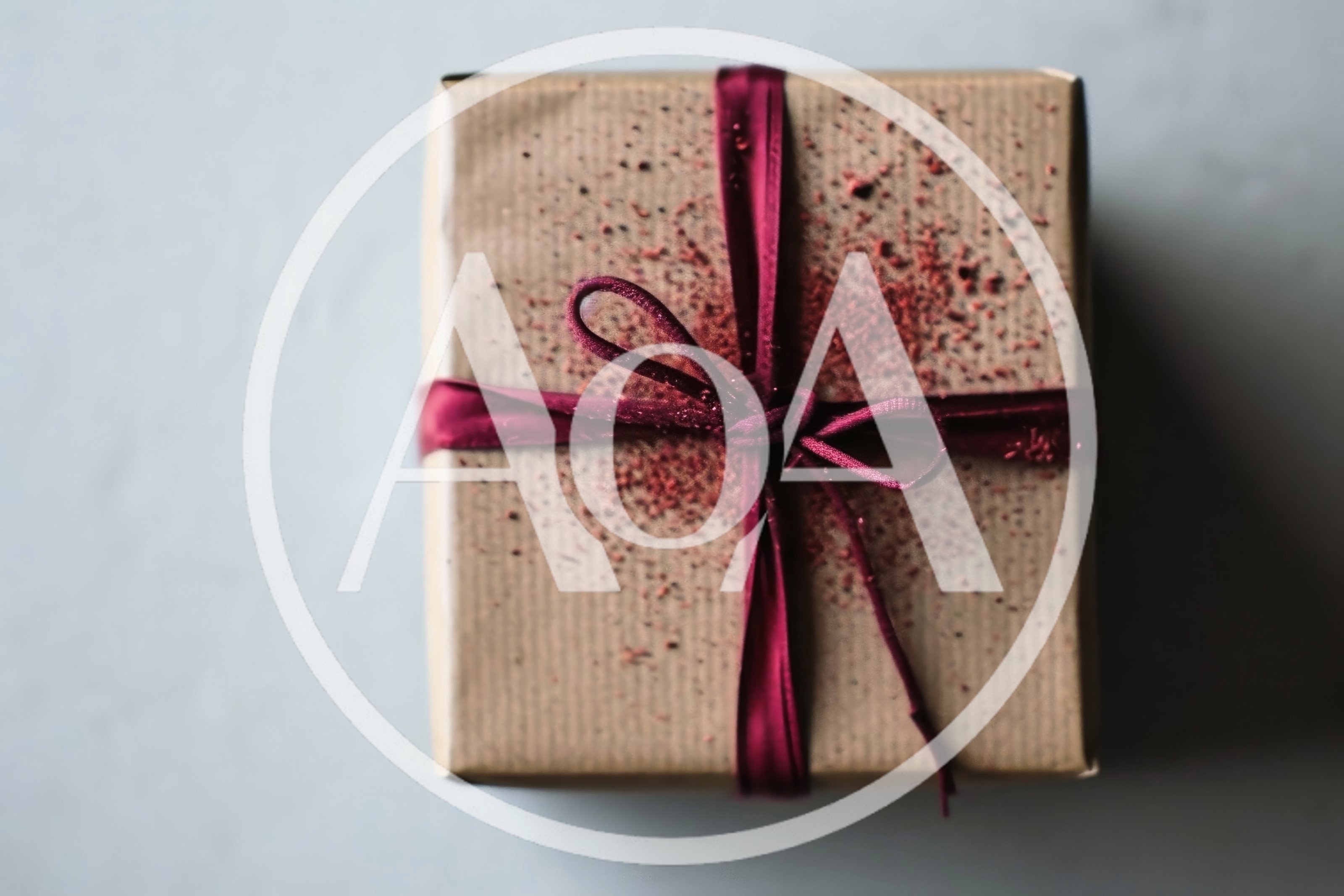 Gift Box Wrapped in Brown Paper with Burgundy Ribbon