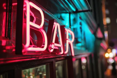 Neon Bar Sign Glowing At Night