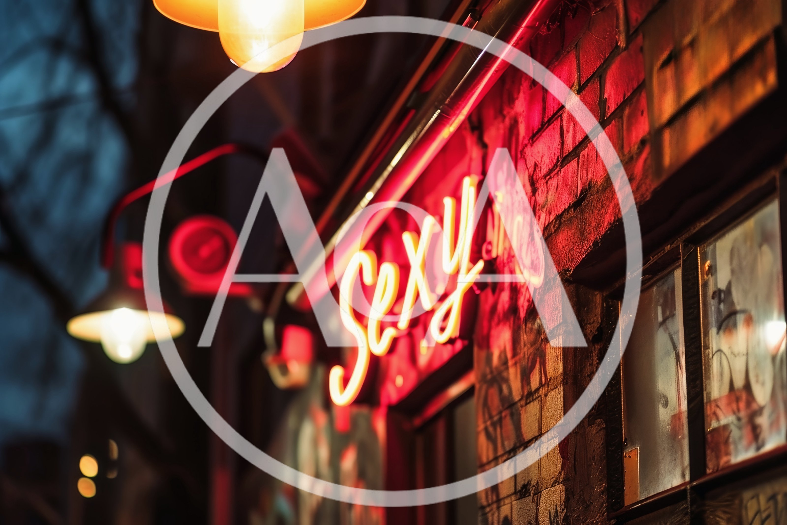 Neon Sexy Sign On A Brick Building At Night