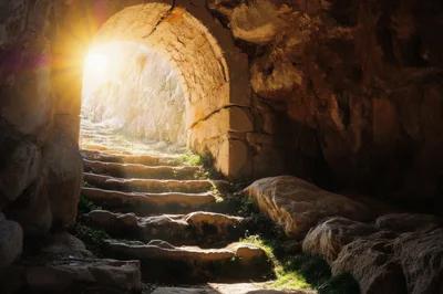 Ancient Stone Staircase Leading Out Of A Dark Cave