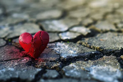 Cracked Red Heart Symbol on Dry Parched Earth