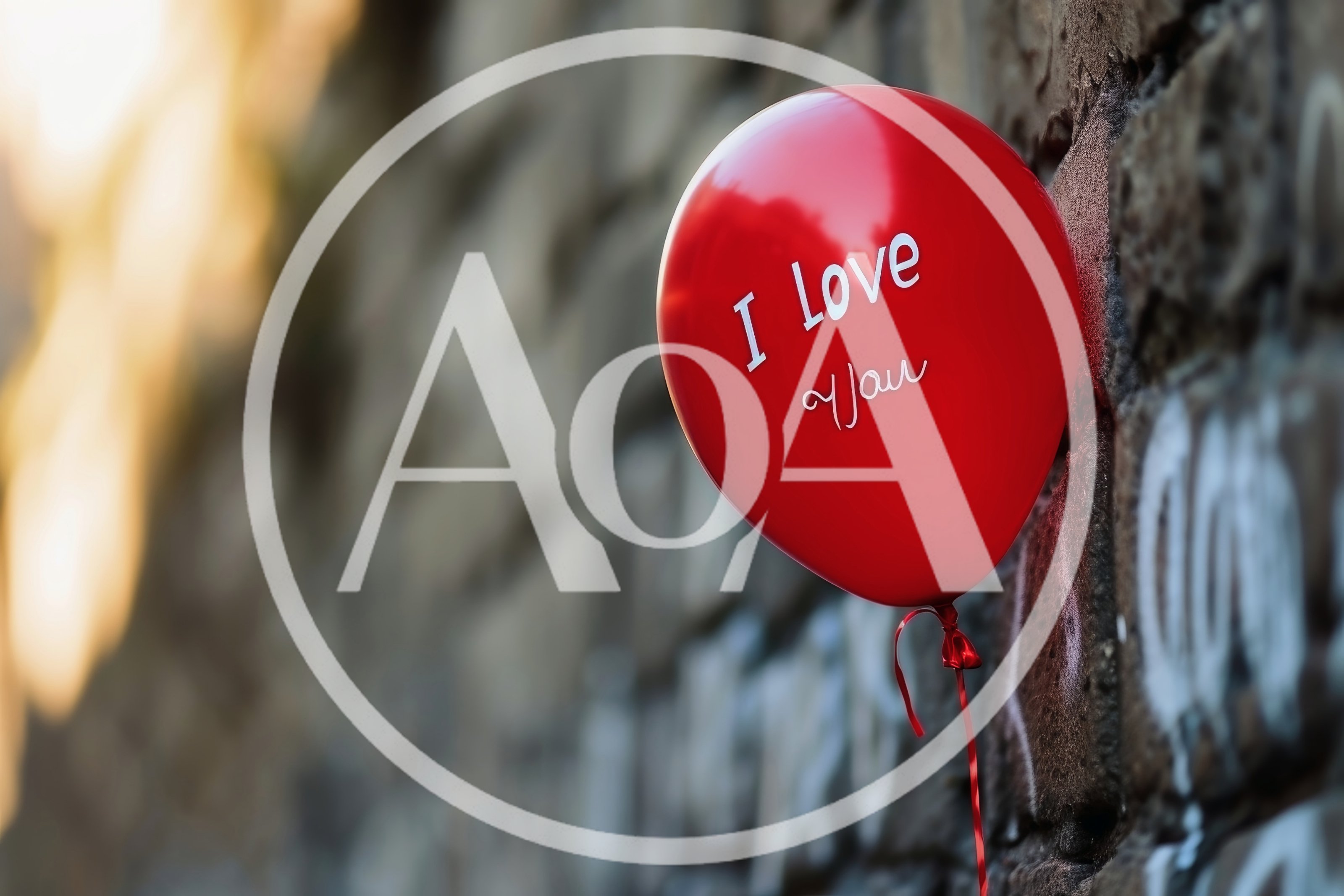Red Balloon With I Love You Text Against Brick Wall