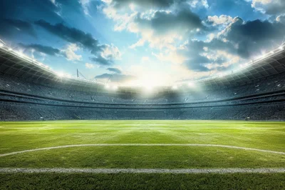 Empty Professional Soccer Stadium Under Dramatic Sunset Sky