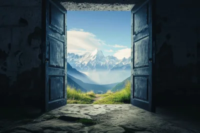 Open Doorway Revealing Majestic Snowy Mountain Landscape