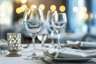 Elegant Table Setting With Wine Glasses In Restaurant