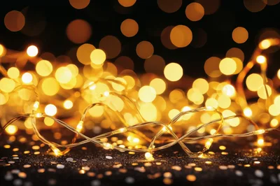 Golden Fairy Lights On Glittering Black Surface