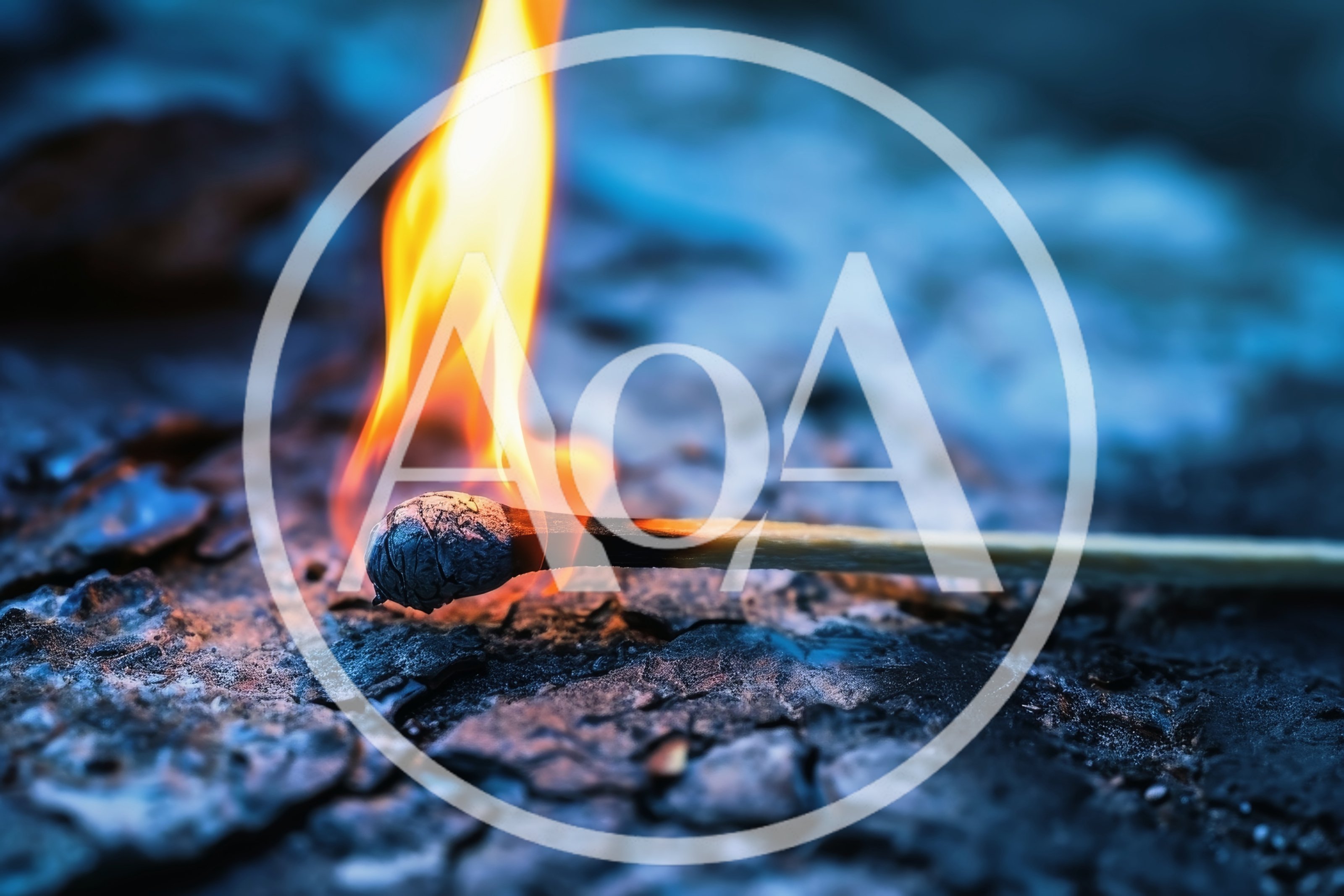 Burning Matchstick Resting On A Dark Textured Surface