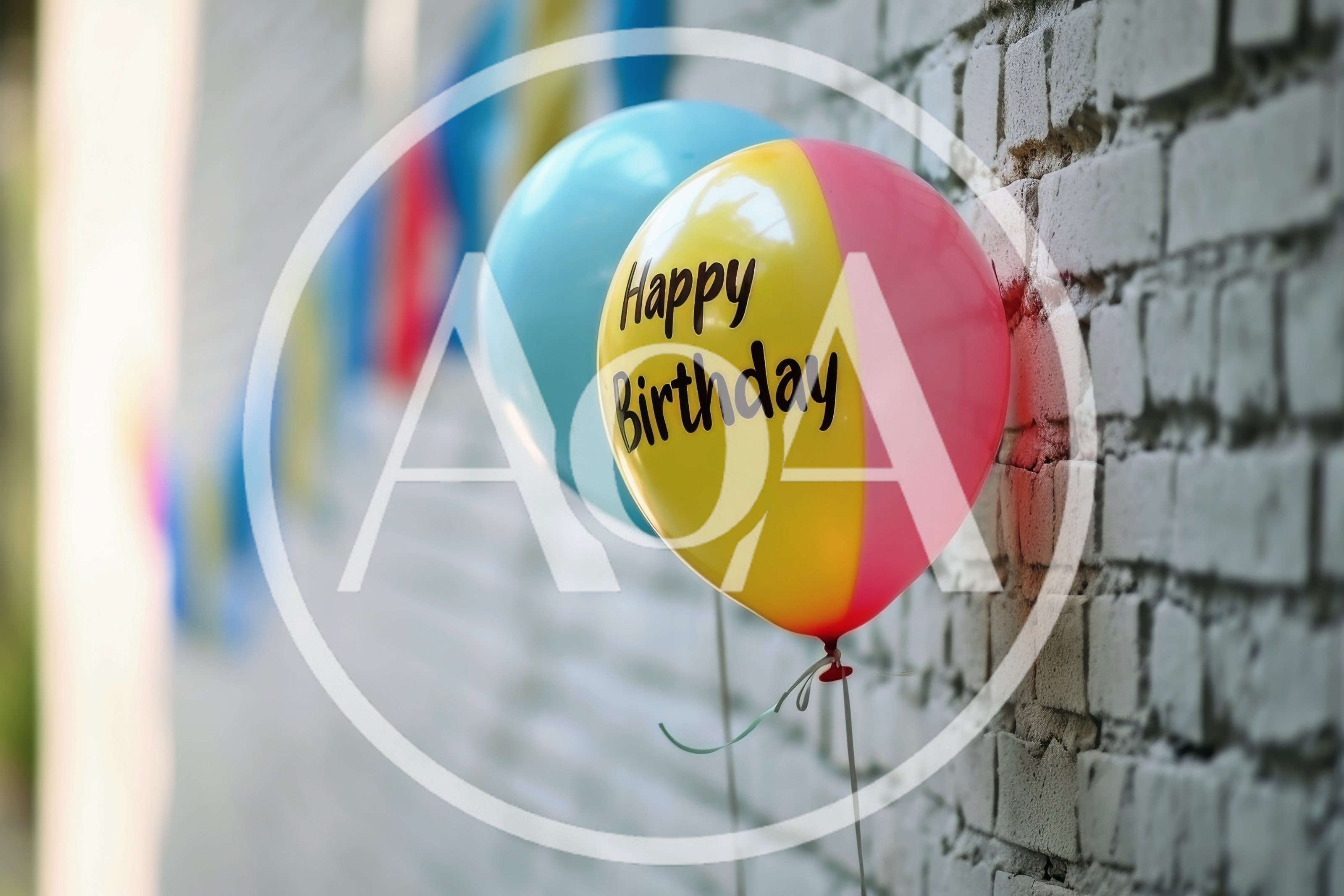 Happy Birthday Balloon Against A White Brick Wall