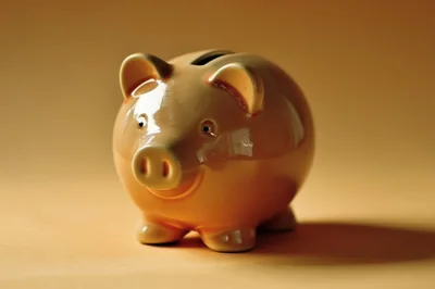 Ceramic Piggy Bank On A Solid Background