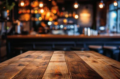 Empty Wooden Table In A Dimly Lit Bar