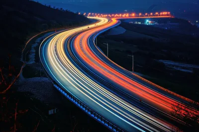 Long Exposure Light Trails On A Curved Highway
