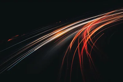 Long Exposure Light Trails On A Dark Highway