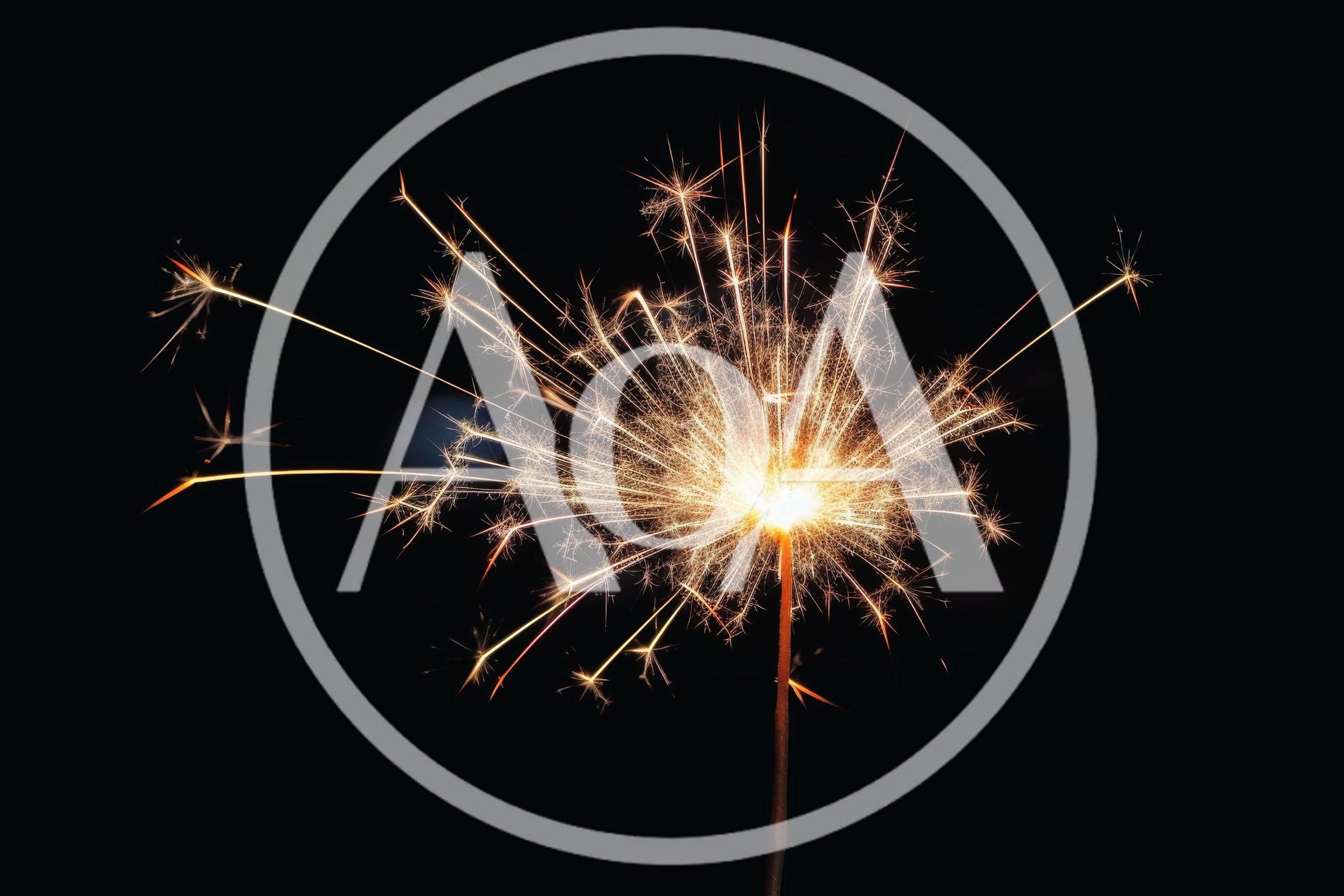 Bright Burning Sparkler Against A Dark Background
