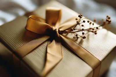 Golden Gift Box With Ribbon And Dried Flowers