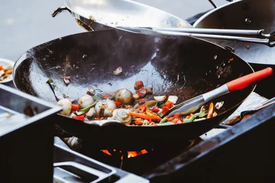 Stir Frying Vegetables In A Large Wok