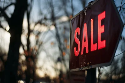 Red Sale Sign Outdoors During Golden Hour