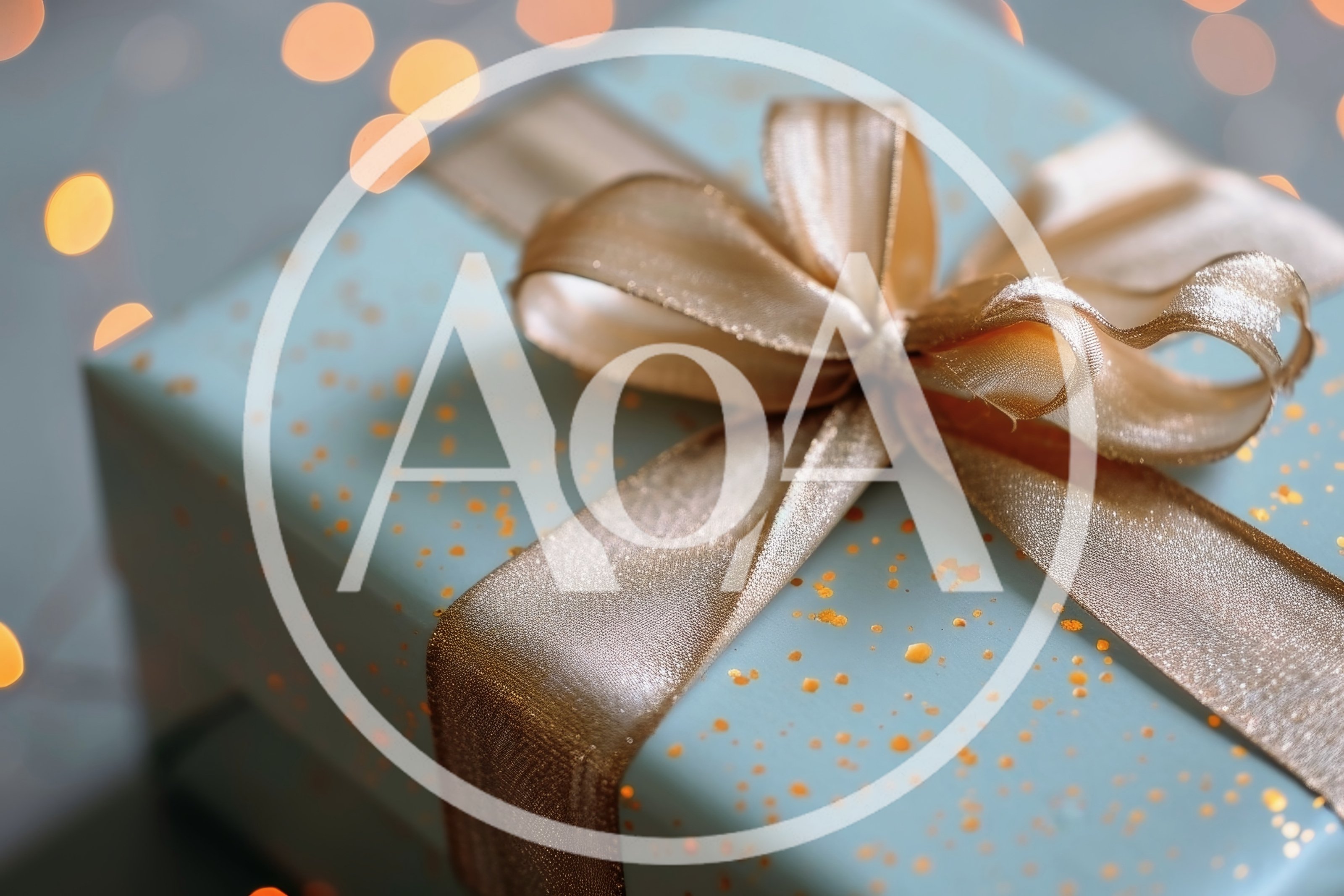 Blue Gift Box With Gold Ribbon And Bokeh Lights
