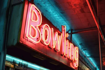 Glowing Neon Bowling Sign At Night