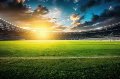 Empty Soccer Stadium Field Under Dramatic Sunset Sky