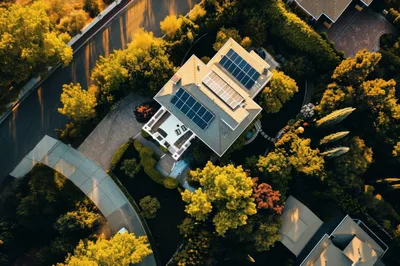 Aerial View Of A Residential House With Solar Panels