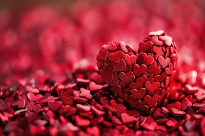 Large Heart Shape Formed From Small Red Heart Confetti