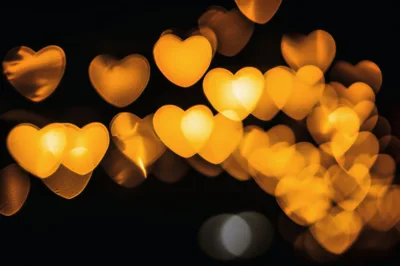 Golden Heart Shaped Bokeh Lights Background