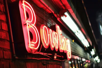 Glowing Neon Bowling Sign On A Brick Wall