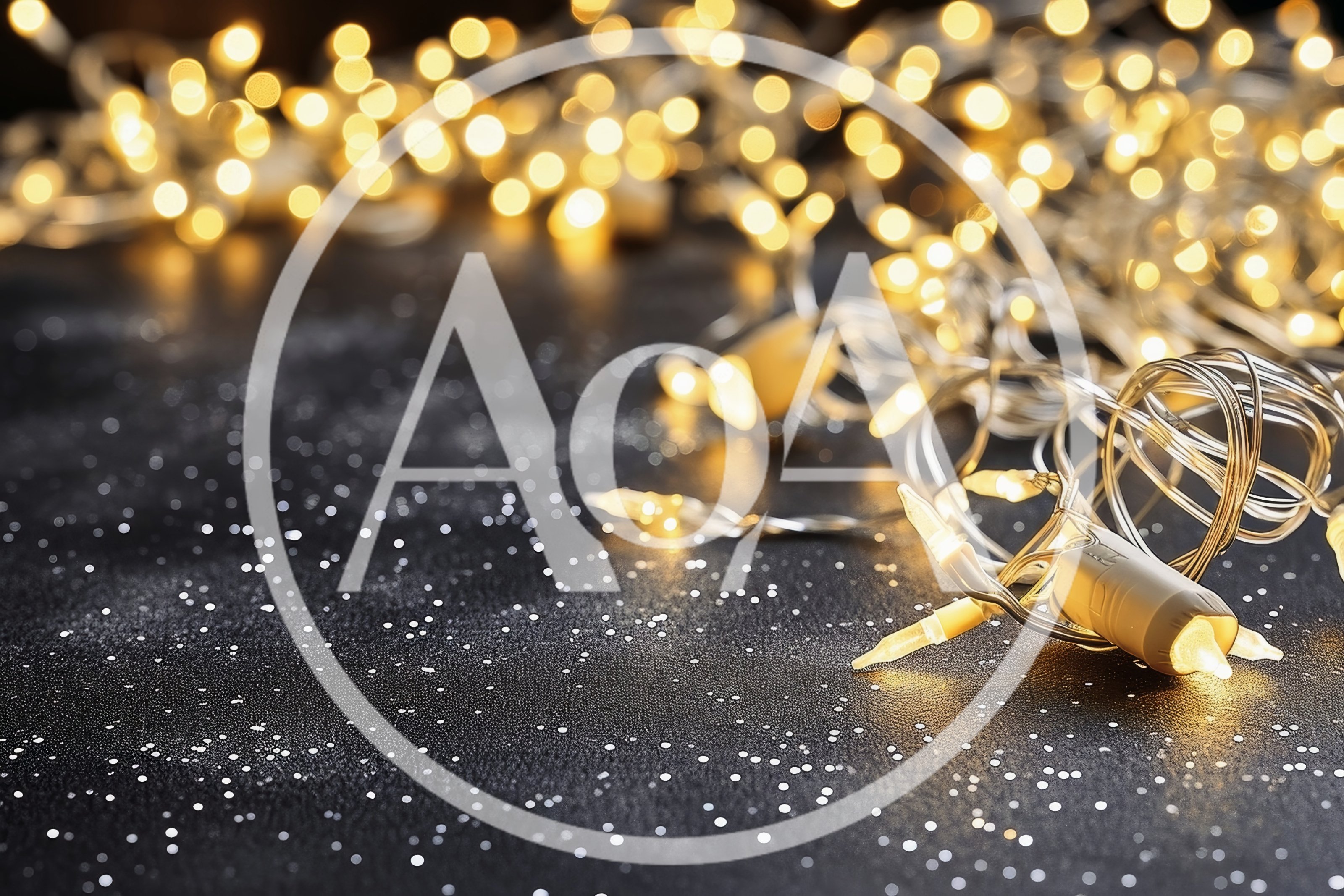 Warm Glowing Christmas Fairy Lights On Dark Surface