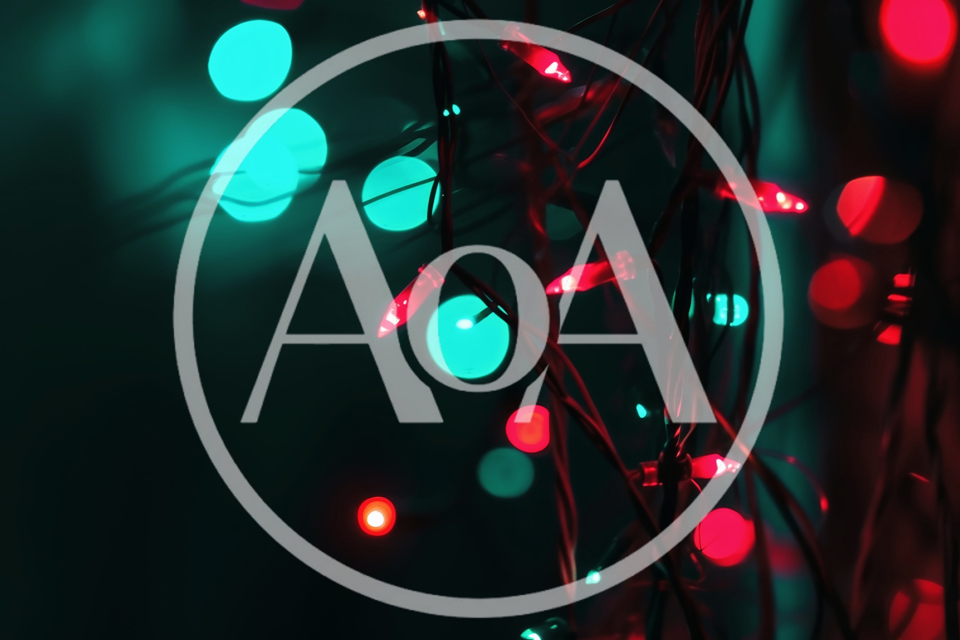 Red Christmas String Lights Against Teal Bokeh Background