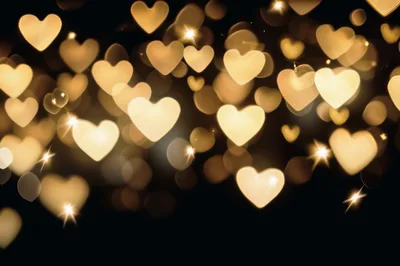 Golden Heart Shaped Bokeh Lights Background