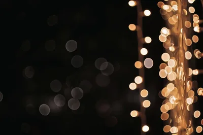 Golden Bokeh String Lights Against Dark Background