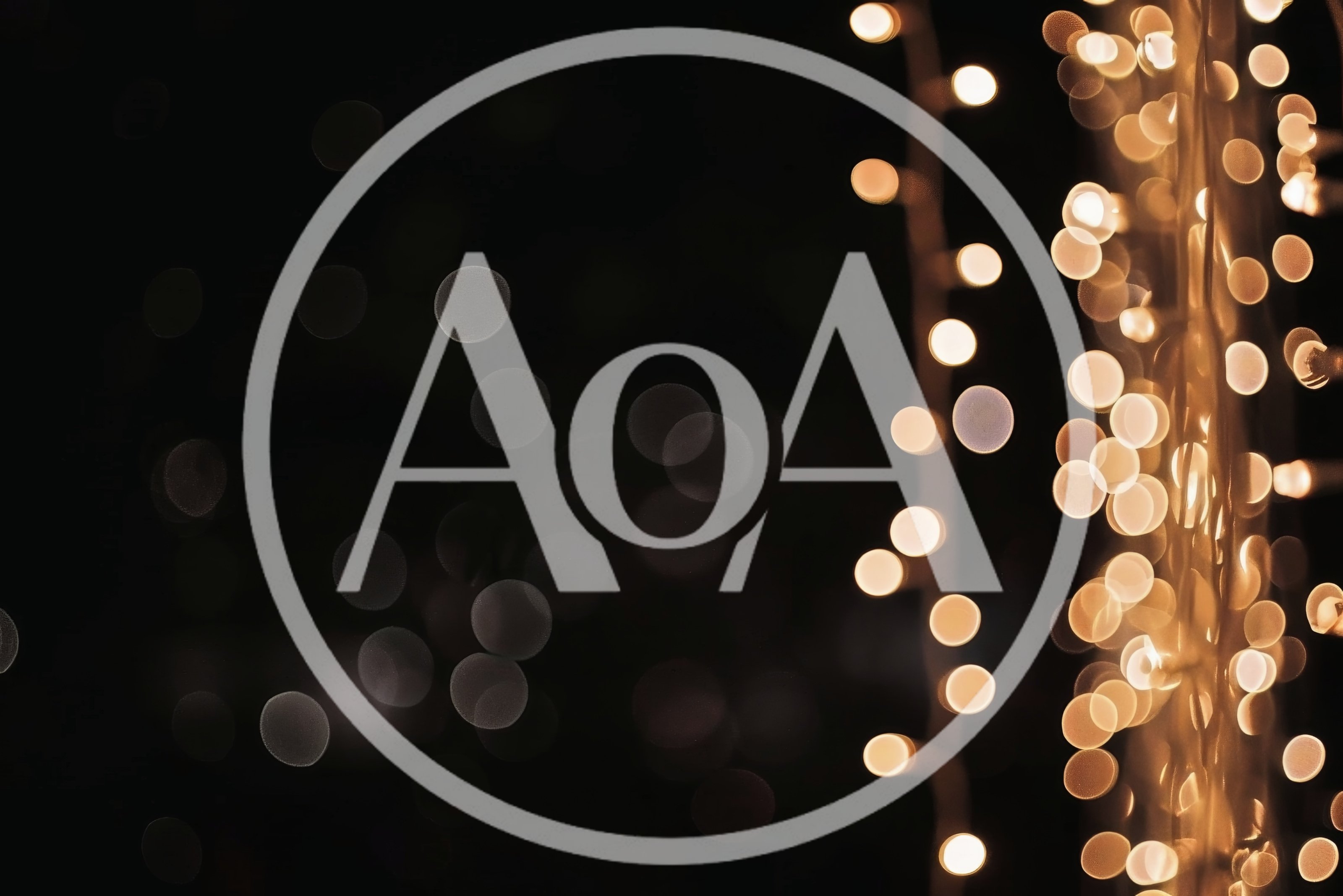 Golden Bokeh String Lights Against Dark Background