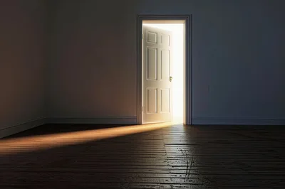 Open Door With Bright Light In Dark Room