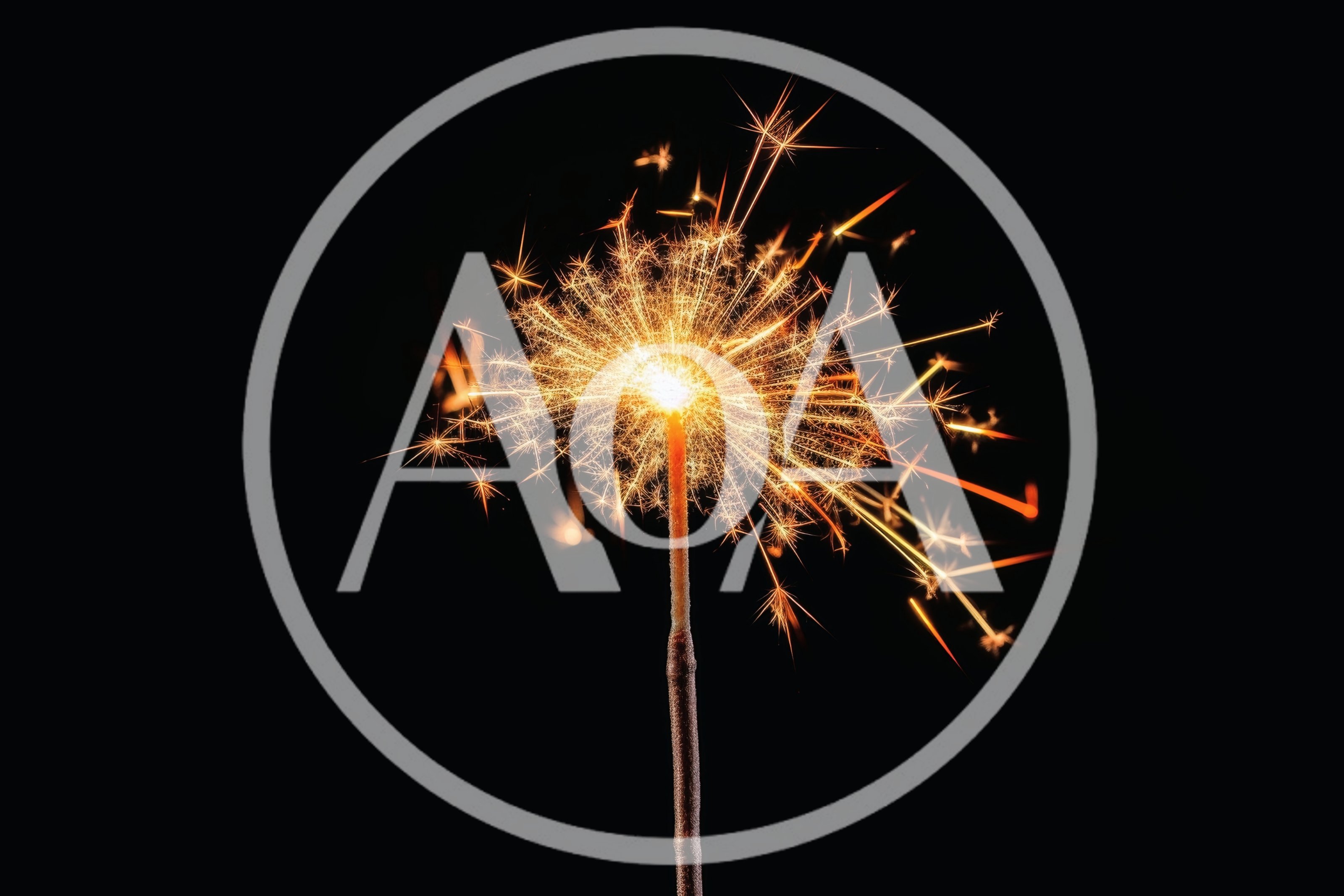 Bright Burning Sparkler Against A Solid Black Background