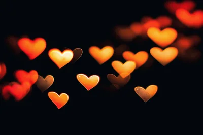 Abstract Bokeh Heart Shapes On Black Background