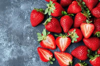 Fresh Ripe Strawberries On A Dark Textured Background