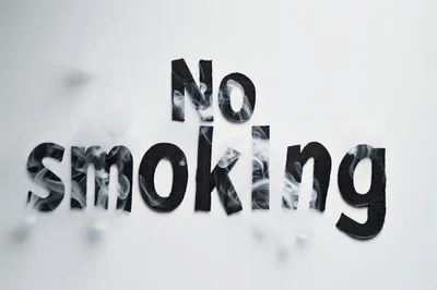 No Smoking Text Cutouts With Wisps Of Smoke