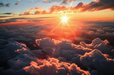 Aerial View Of Golden Sunset Above Dense Clouds