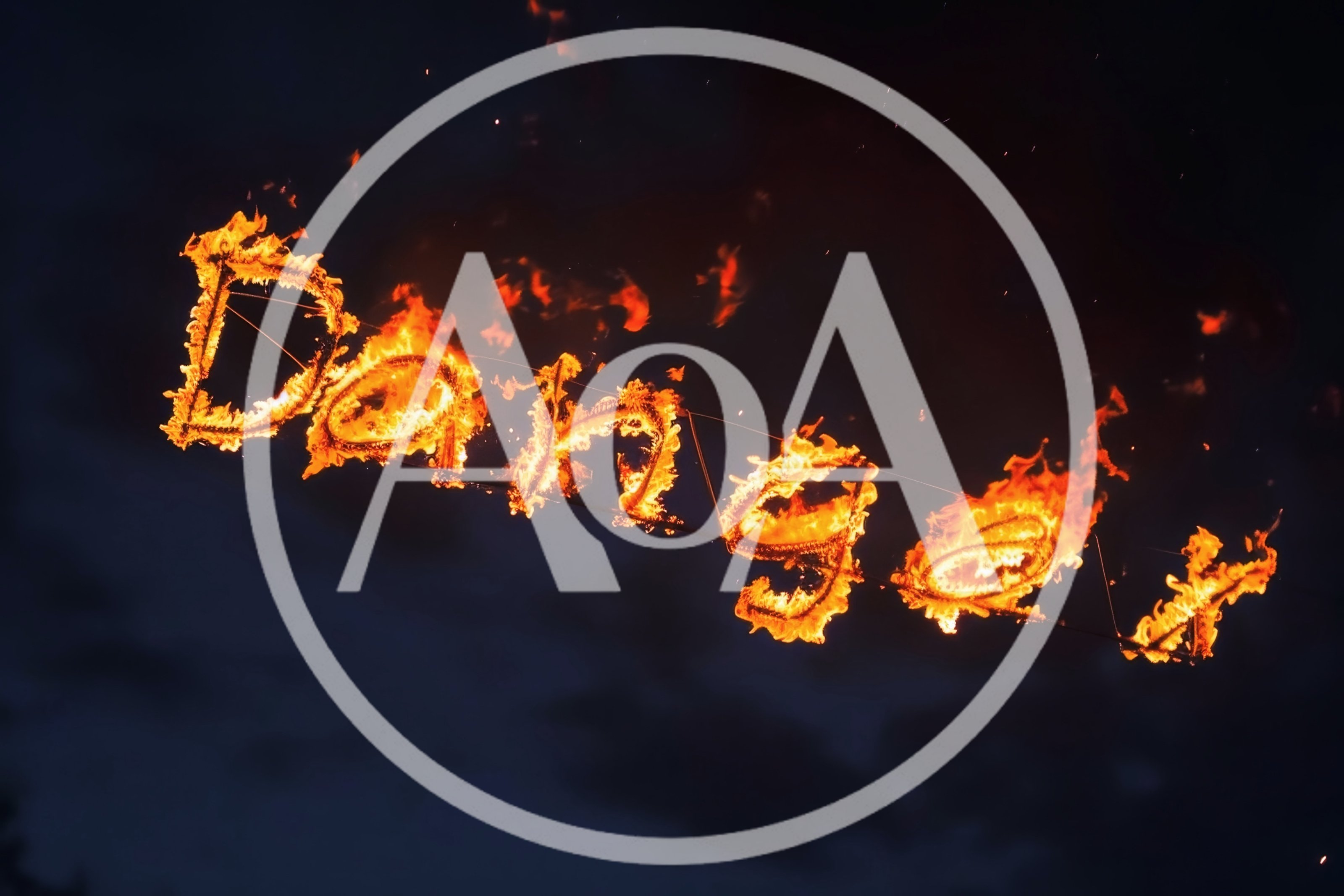 Flaming Danger Sign Written In Fire Against Dark Sky
