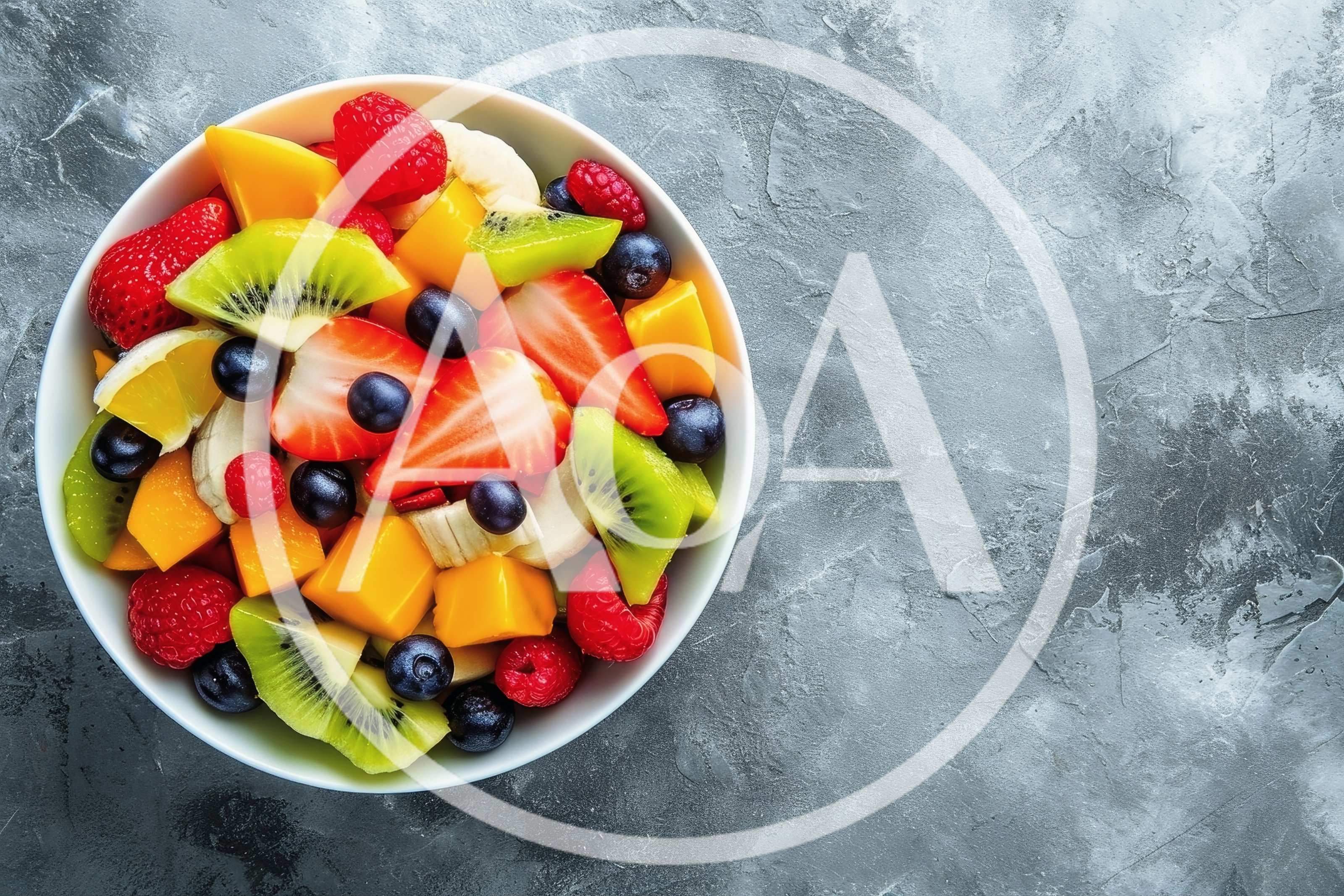 Fresh Fruit Salad Bowl on Concrete Background