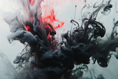 Black And Red Ink Swirling In Water