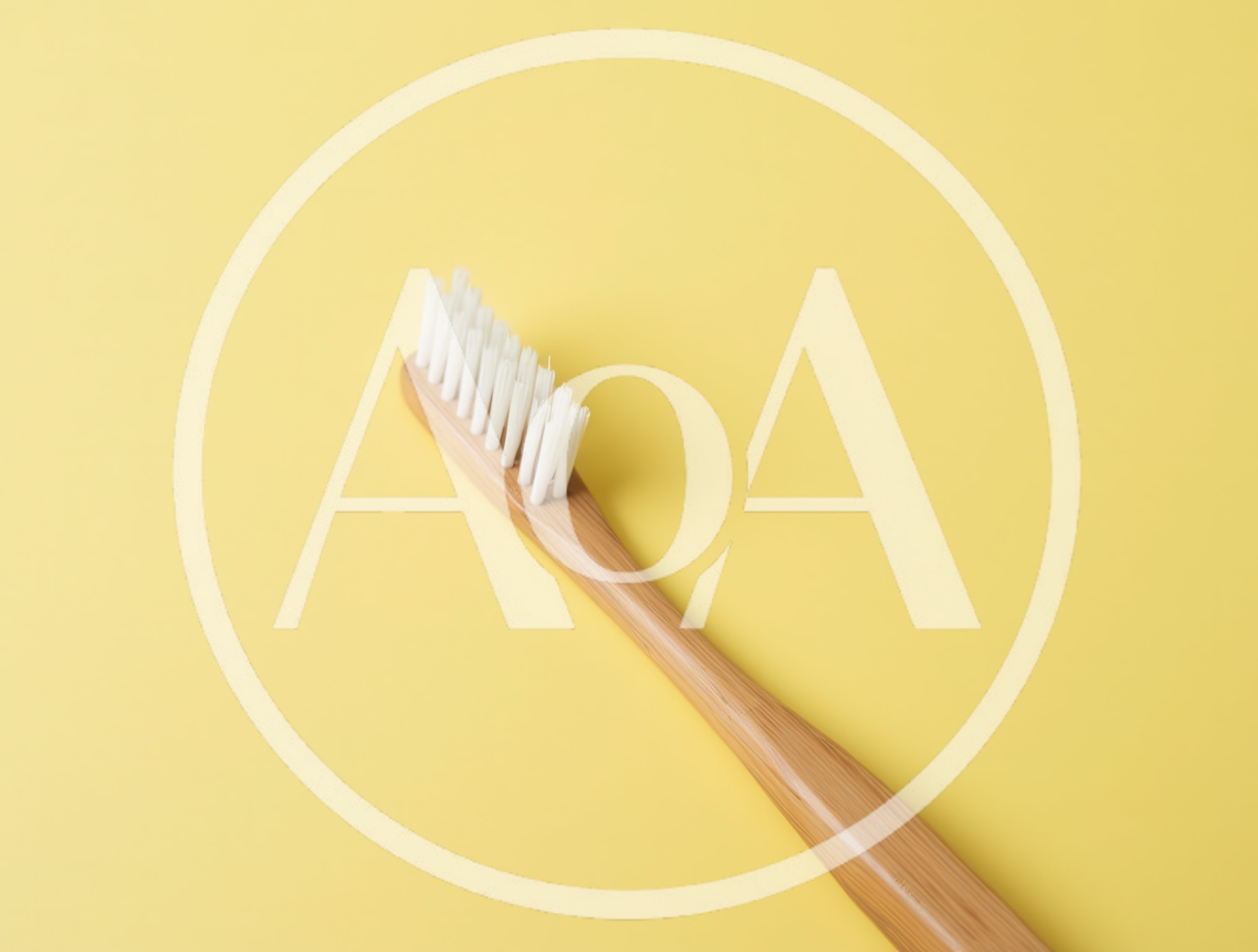 Eco Friendly Bamboo Toothbrush on Yellow Background